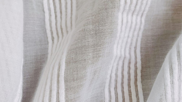 White gauzy fabric with stripped design