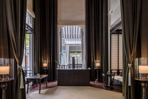 Thailand Hotel Spa Room with Desk and dark wooden furniture